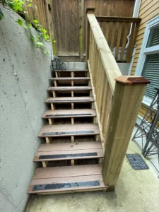 a staircase attached to a concrete wall