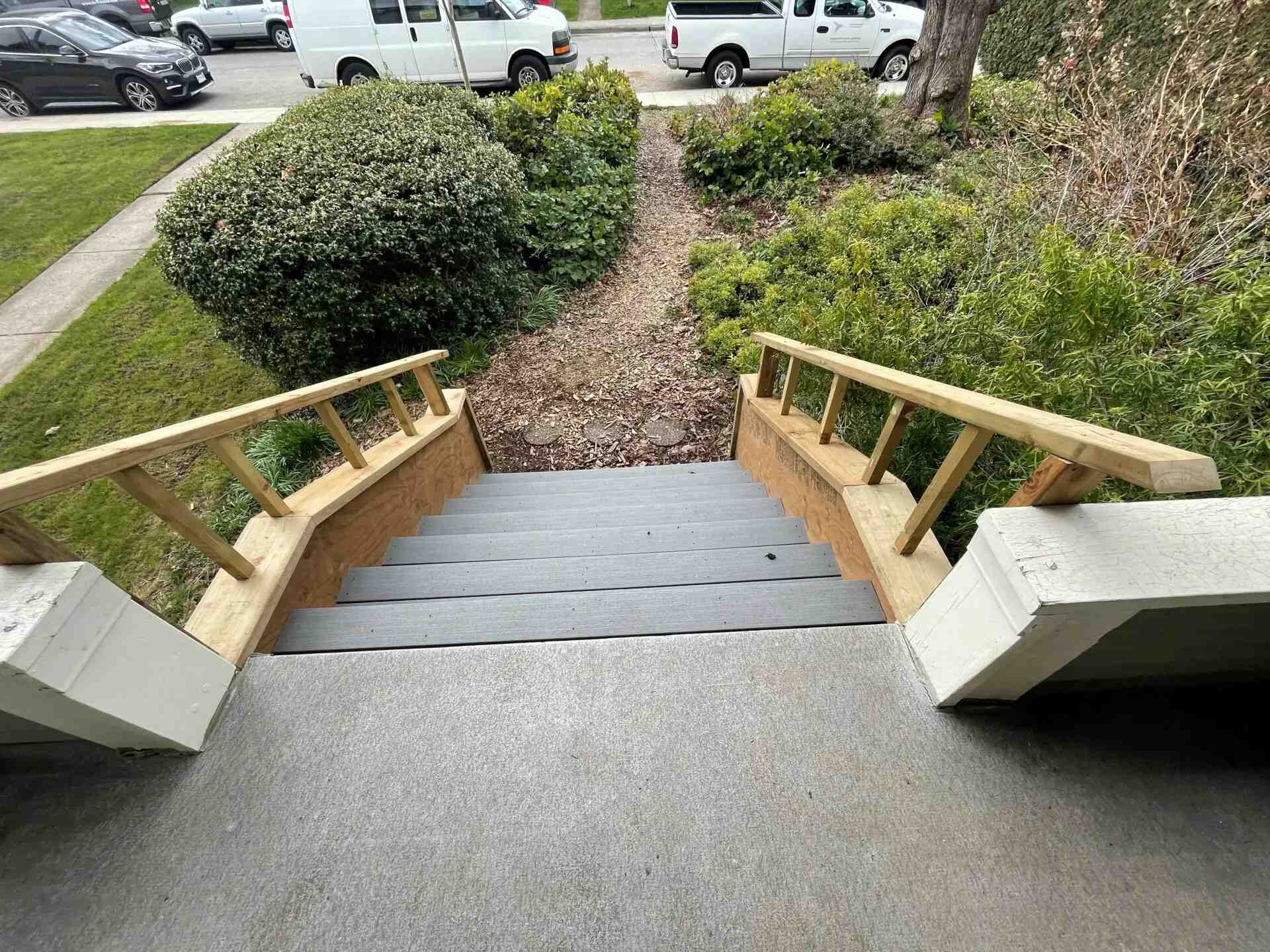 stairs with wood railing