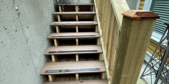 a staircase attached to a concrete wall